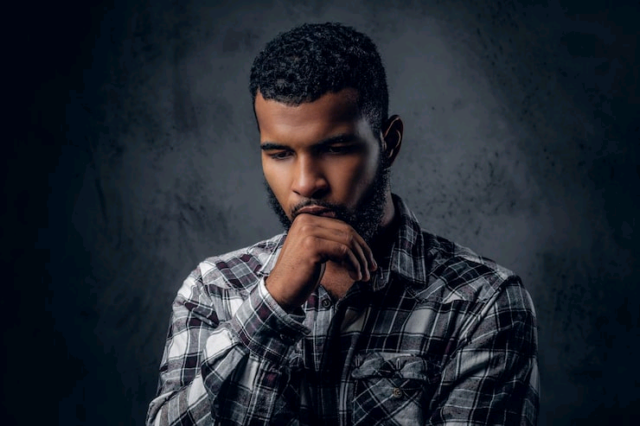 dramatic-portrait-black-pensive-male-dark-grey-background_613910-10132(1)