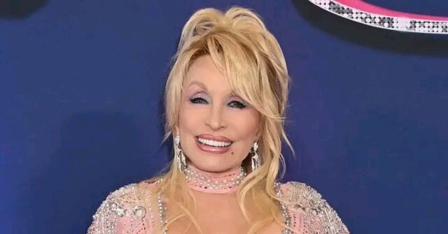 Dolly Parton smiling during a public appearance Description: Dolly Parton's legacy in Tennessee has inspired a campaign to name Nashville's main airport after her. Credit: Getty Images